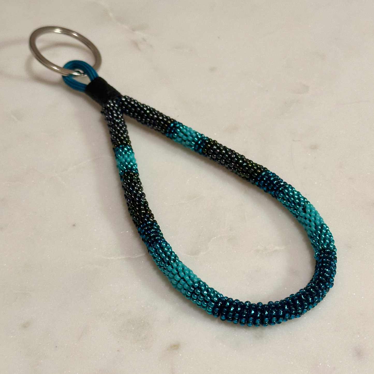 Rvfo Okholatte (Turquoise Winter) Bead-Wrapped Wristlet Keychain